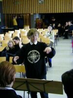 Anneliese Malischewski is conducting the Handbell Choir Aldenhoven
