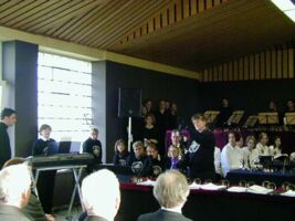 Rise performing a handbell solo, lots of handbells and just one ringer